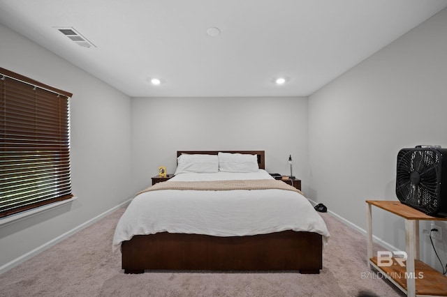 carpeted bedroom featuring baseboards, visible vents, and recessed lighting