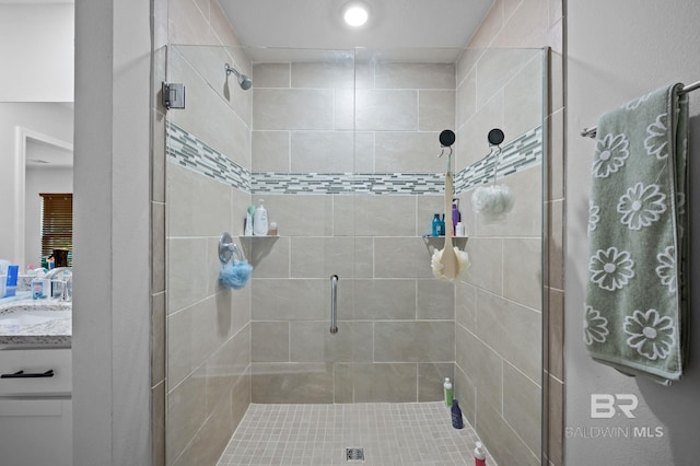 bathroom featuring vanity and a stall shower