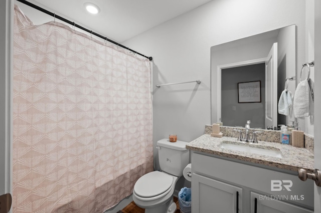 full bathroom with toilet, shower / bathtub combination with curtain, and vanity