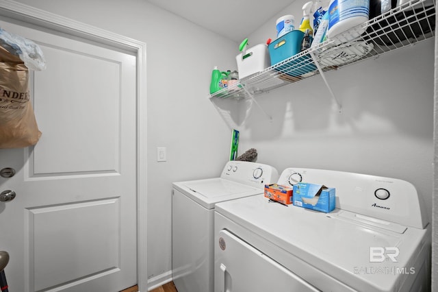 clothes washing area with laundry area and washing machine and clothes dryer