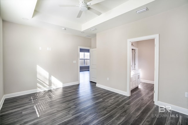 5241 Plateau Rd, Pensacola, FL 32507 - spare room with a tray ceiling, ceiling fan, dark wood-style floors, and baseboards