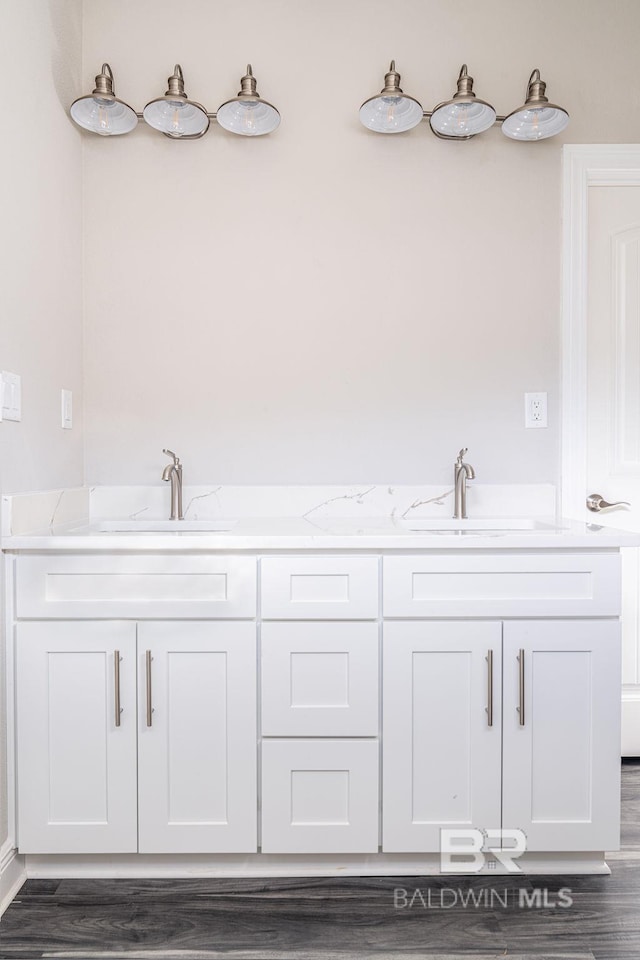 5241 Plateau Rd, Pensacola, FL 32507 - full bath featuring wood finished floors and double vanity