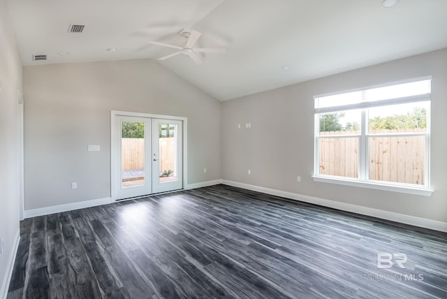 5241 Plateau Rd, Pensacola, FL 32507 - spare room with a ceiling fan, baseboards, lofted ceiling, dark wood-style floors, and french doors