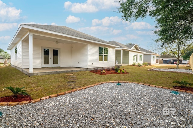 5241 Plateau Rd, Pensacola, FL 32507 - back of house featuring a ceiling fan, a lawn, a patio area, and french doors