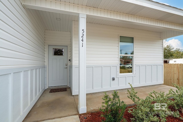 5241 Plateau Rd, Pensacola, FL 32507 - entrance to property featuring board and batten siding, a porch, and fence