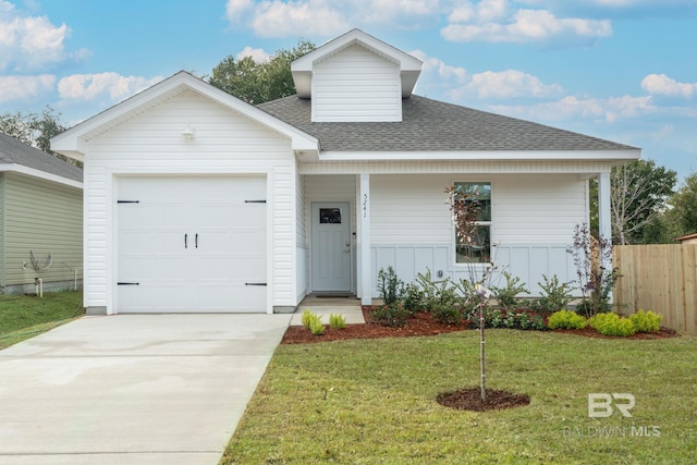 5241 Plateau Rd, Pensacola, FL 32507 - view of front facade featuring a shingled roof, a garage, and concrete driveway