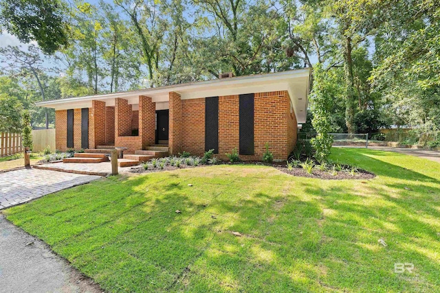 view of front of home with a front yard