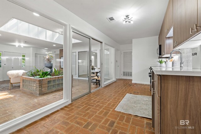 kitchen featuring backsplash, stainless steel appliances, and sink