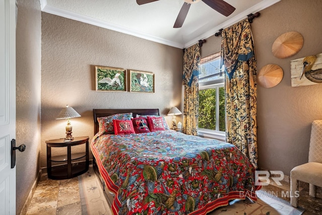 14755 Innerarity Point Rd, Pensacola, FL 32507 - bedroom featuring ornamental molding, baseboards, a ceiling fan, and a textured wall