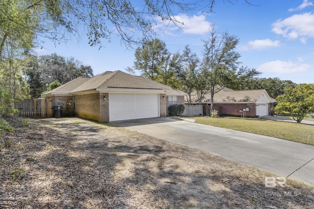 single story home with driveway, a garage, fence, a front lawn, and brick siding