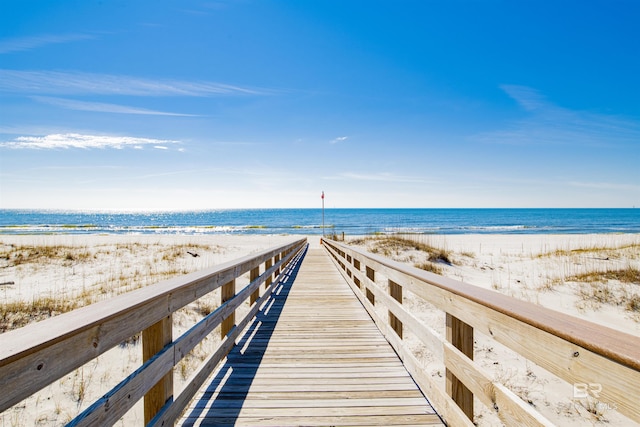 view of home's community featuring a view of the beach and a water view