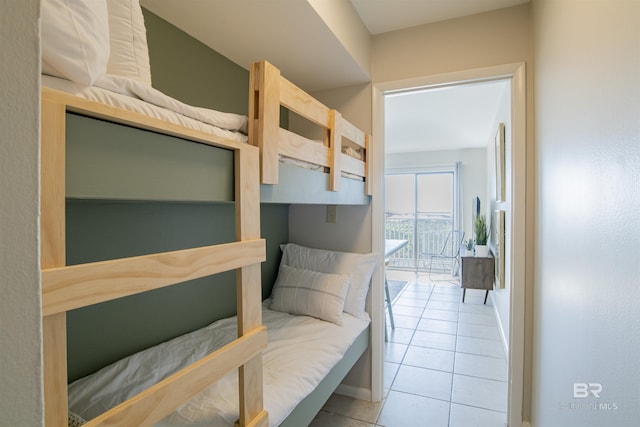 bedroom featuring access to outside and light tile patterned floors