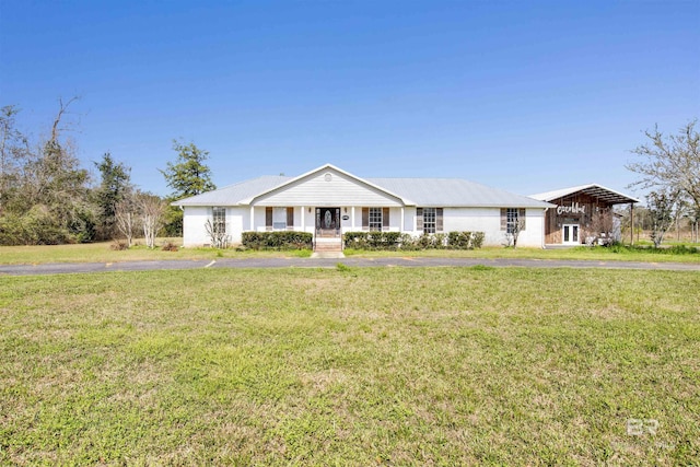 ranch-style home with a carport and a front yard