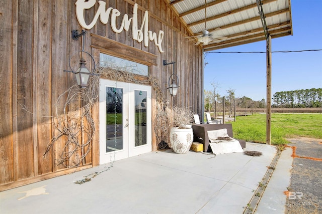 view of patio with french doors and ceiling fan