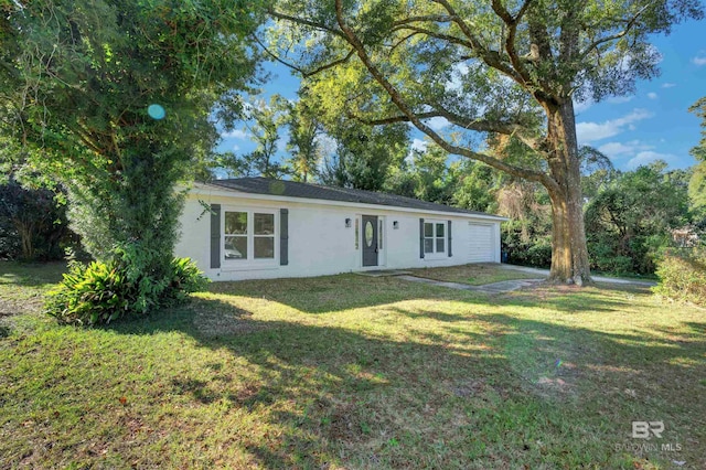 ranch-style home featuring a front yard