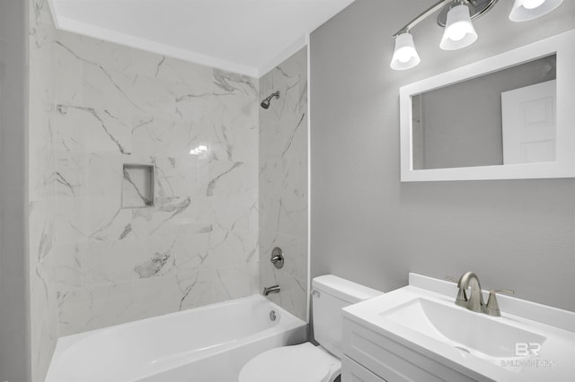 full bathroom with vanity, toilet, and tiled shower / bath