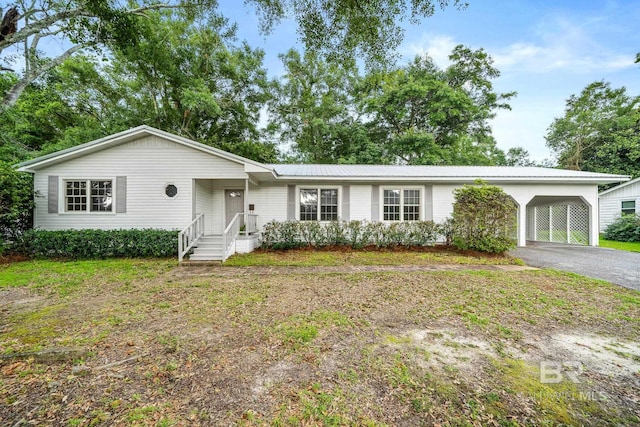 ranch-style house with a carport