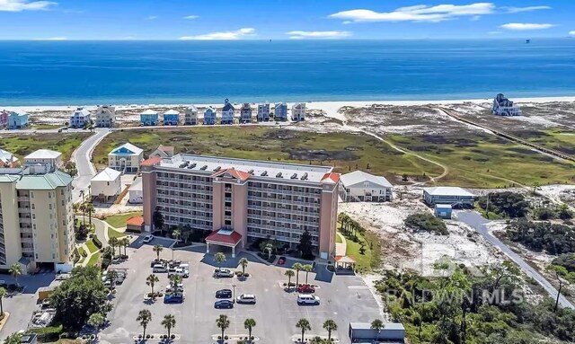 aerial view with a view of the beach and a water view