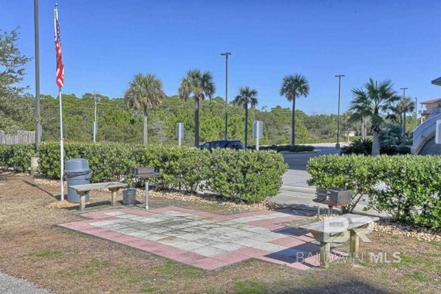 view of home's community with a patio area