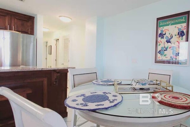 dining room with light tile patterned flooring