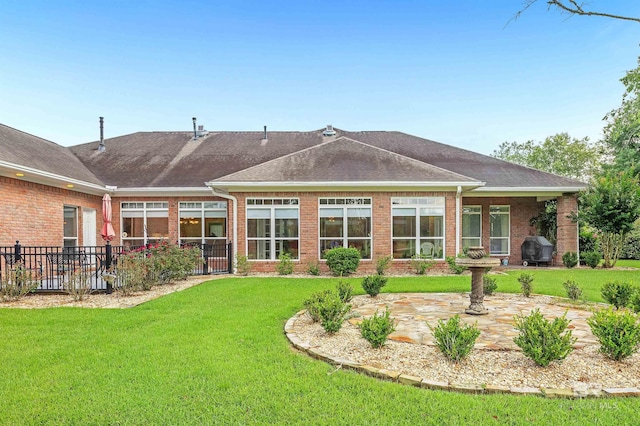 715 Village Dr, Gulf Shores, AL 36542 - back of house with brick siding, a patio area, and a shingled roof