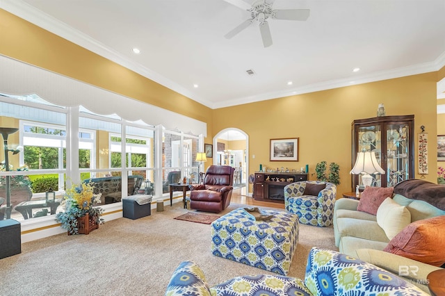 715 Village Dr, Gulf Shores, AL 36542 - carpeted living area with arched walkways, a ceiling fan, ornamental molding, recessed lighting, and a fireplace