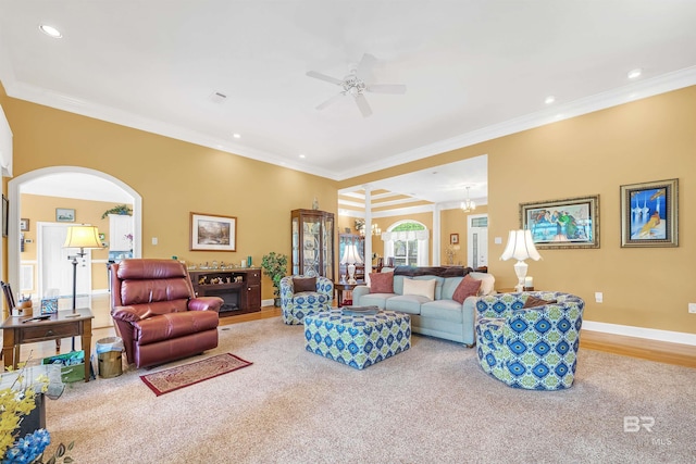 715 Village Dr, Gulf Shores, AL 36542 - living room featuring ceiling fan, crown molding, recessed lighting, arched walkways, and carpet flooring