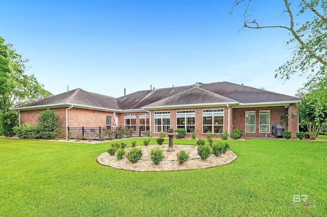 715 Village Dr, Gulf Shores, AL 36542 - rear view of house featuring brick siding and a patio