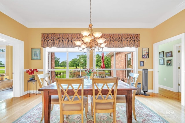 715 Village Dr, Gulf Shores, AL 36542 - dining room featuring a chandelier and light wood-style floors