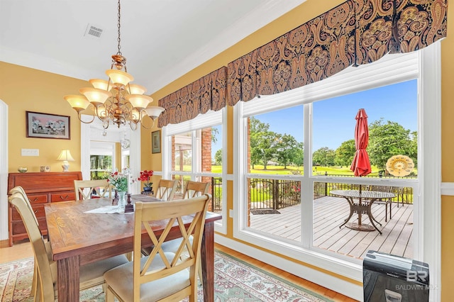 715 Village Dr, Gulf Shores, AL 36542 - dining space featuring a chandelier and wood finished floors