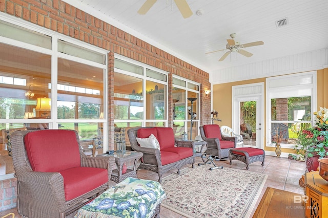 715 Village Dr, Gulf Shores, AL 36542 - sunroom with ceiling fan and outdoor lounge area