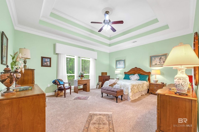 715 Village Dr, Gulf Shores, AL 36542 - carpeted bedroom featuring a tray ceiling, ornamental molding, and a ceiling fan