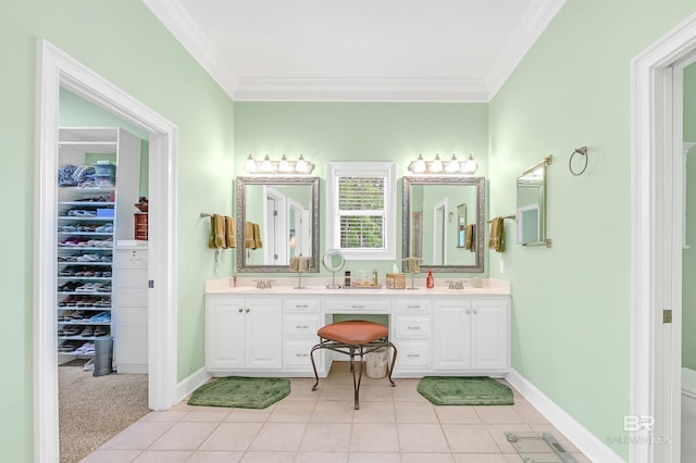 715 Village Dr, Gulf Shores, AL 36542 - full bathroom featuring double vanity, crown molding, tile patterned floors, and a walk in closet