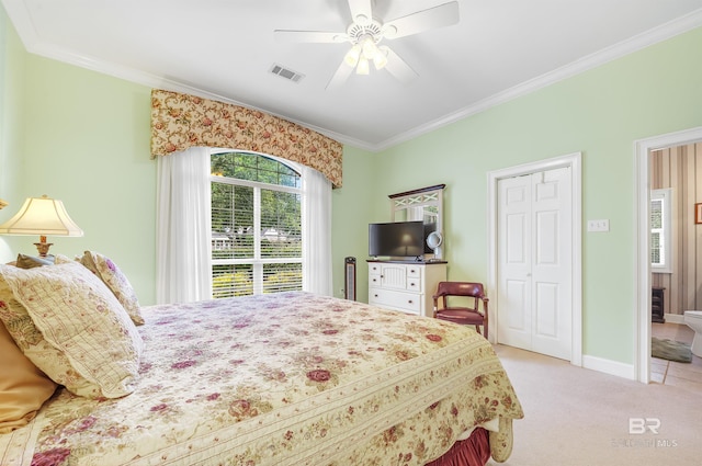 715 Village Dr, Gulf Shores, AL 36542 - bedroom with multiple windows, crown molding, carpet flooring, a closet, and a ceiling fan