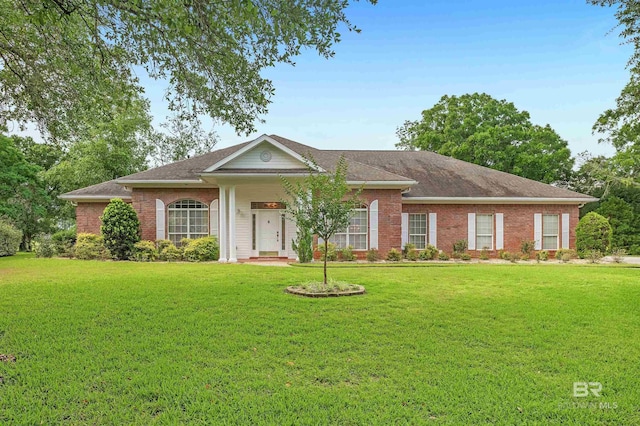 715 Village Dr, Gulf Shores, AL 36542 - single story home with a front yard and brick siding
