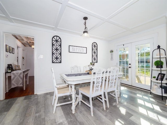 dining area with coffered ceiling, beam ceiling, wood-type flooring, and french doors