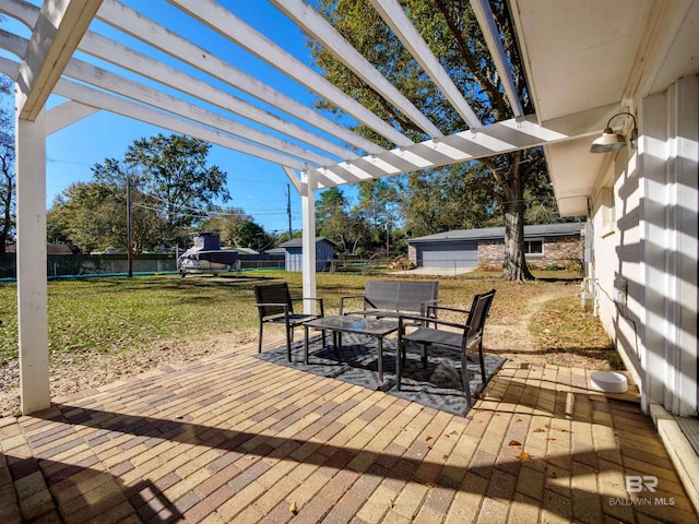 wooden terrace with a pergola, a lawn, an outdoor structure, and a patio area