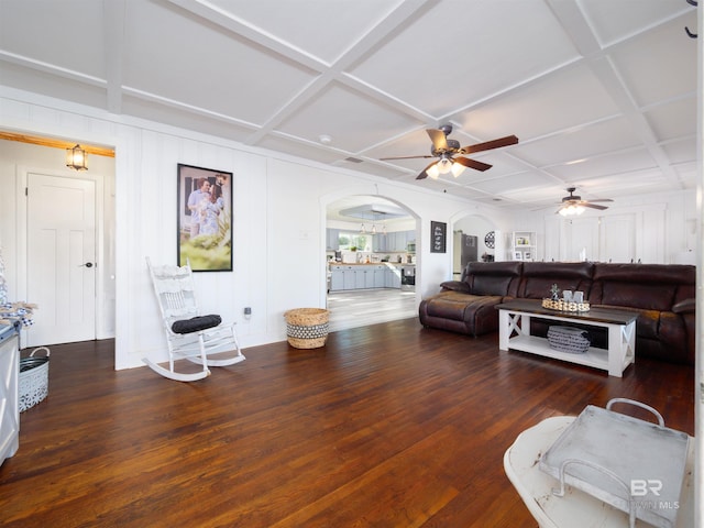 living room with coffered ceiling, dark hardwood / wood-style floors, and ceiling fan