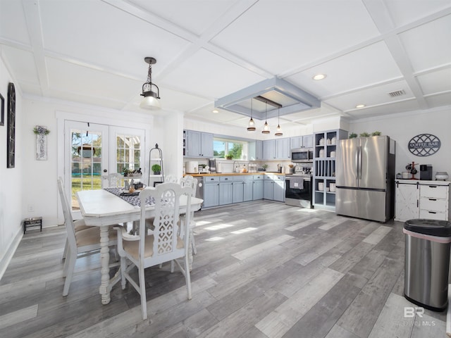 dining room with beamed ceiling, coffered ceiling, light wood-type flooring, and french doors