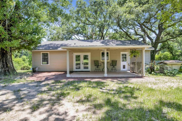 back of house with french doors, ceiling fan, and a patio area