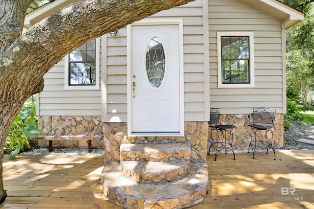 entrance to property with a wooden deck