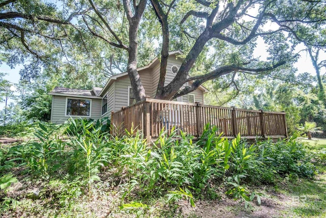 view of home's exterior featuring a deck