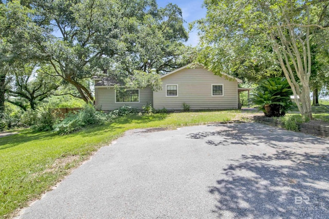 view of property exterior with a yard