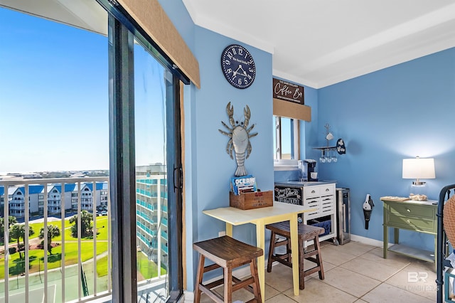 tiled dining room with baseboards