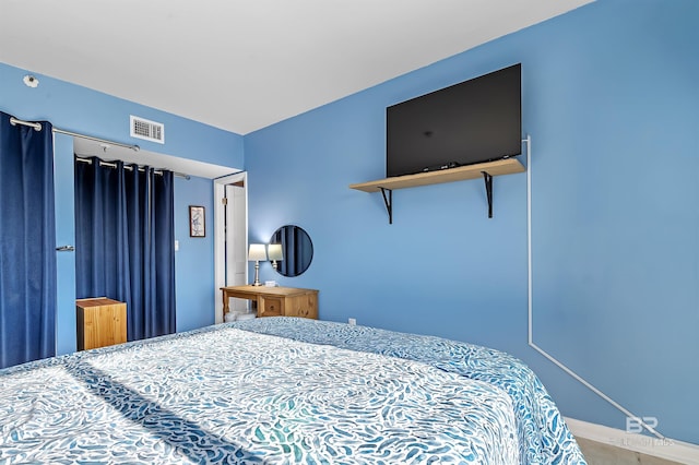 bedroom featuring visible vents