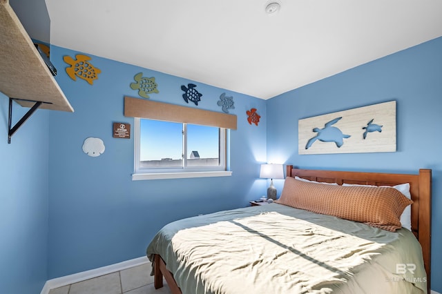 tiled bedroom with baseboards