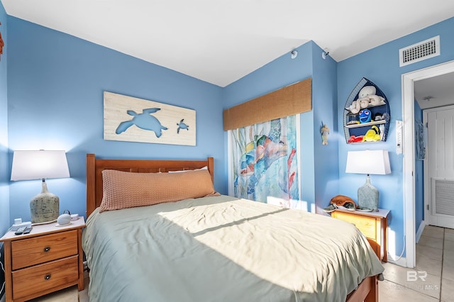 bedroom featuring visible vents