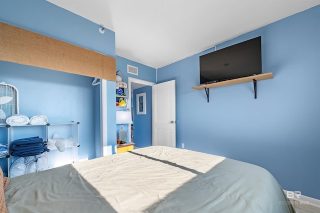 bedroom featuring visible vents