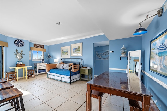 bedroom with light tile patterned floors