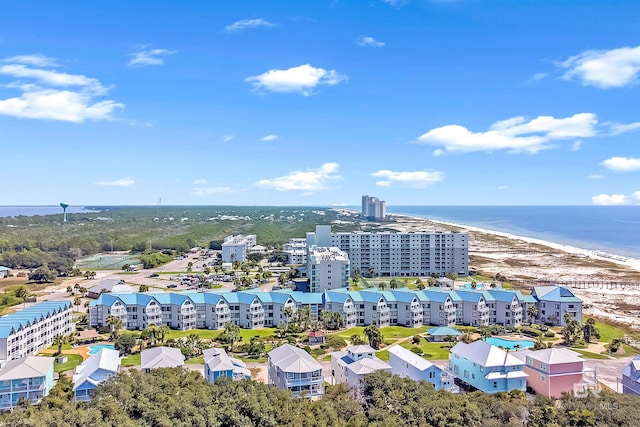 drone / aerial view featuring a water view and a view of the beach